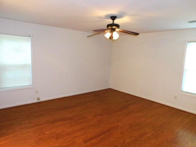 1710 Pine Road Marietta, GA 30062 - Photo 19 of 23 an empty room with a window and a chandelier fan
