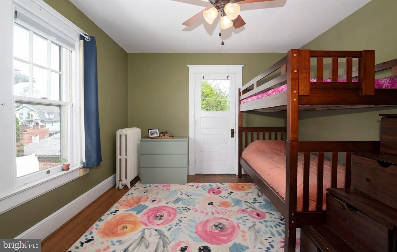 1505 3rd Avenue York, PA 17403 - Photo 9 of 12 a bedroom with a bed and a chandelier