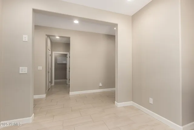 an empty room with closet and a bathroom