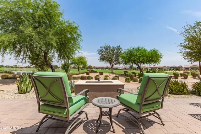 a view of a chairs and table in the patio