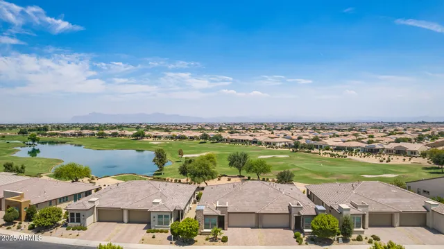 an aerial view of a city with lake view