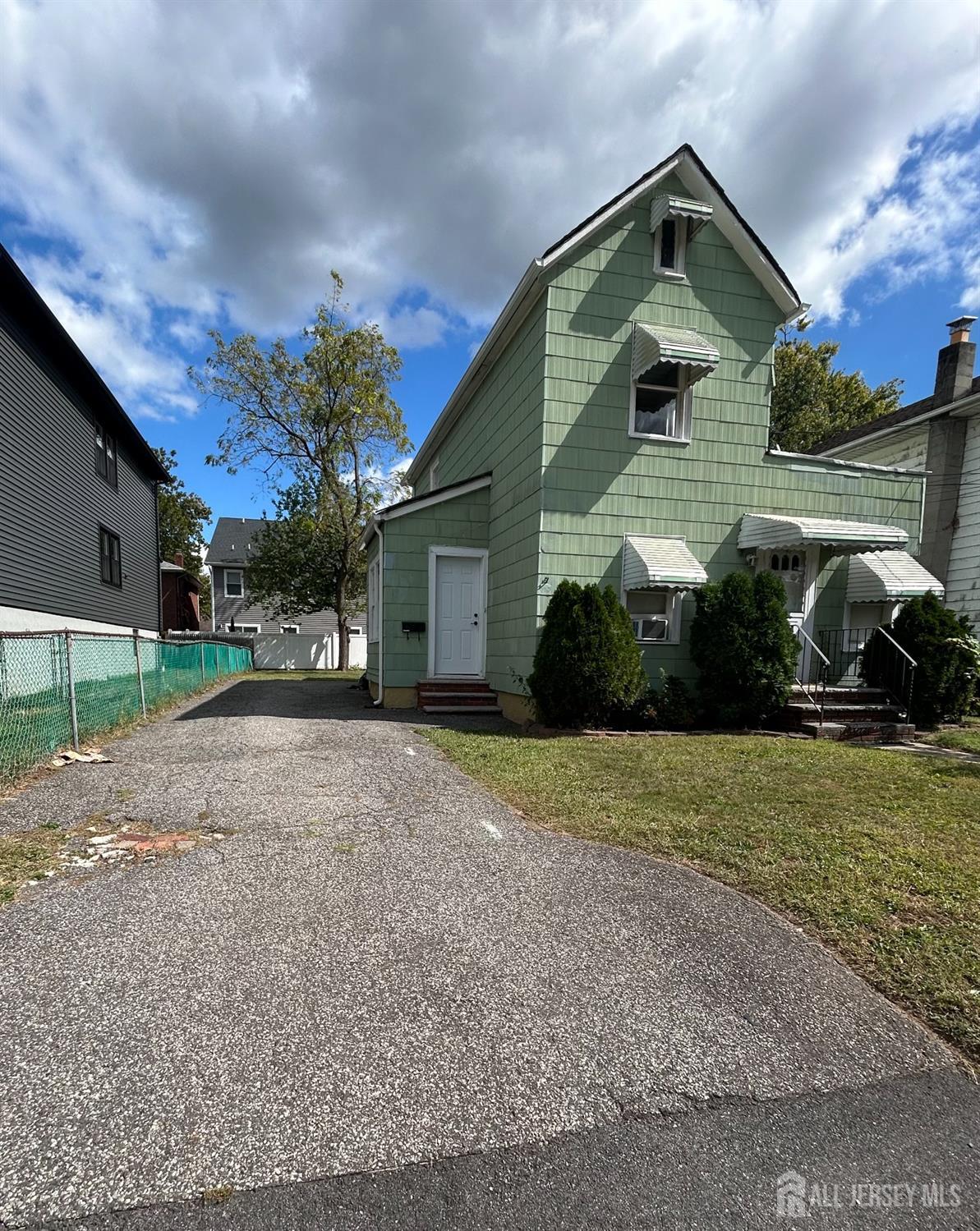 239 North 10th Street Kenilworth, NJ 07033 - Photo 3 of 8 a front view of a house with a yard