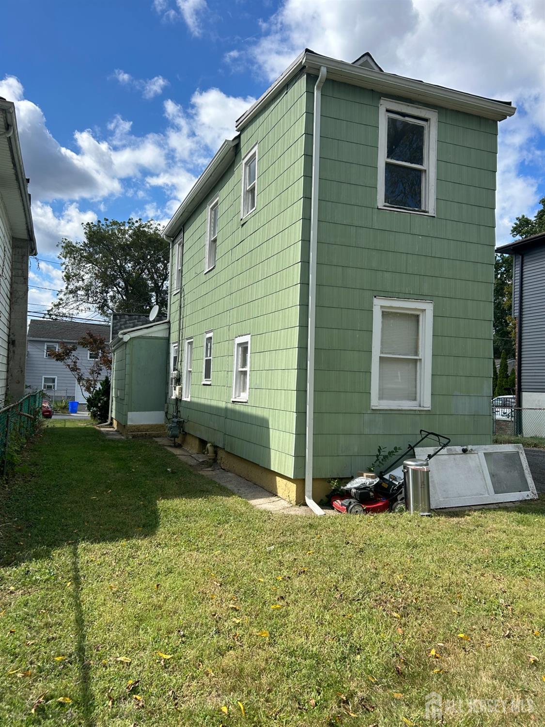 239 North 10th Street Kenilworth, NJ 07033 - Photo 5 of 8 a backyard of a house with table and chairs