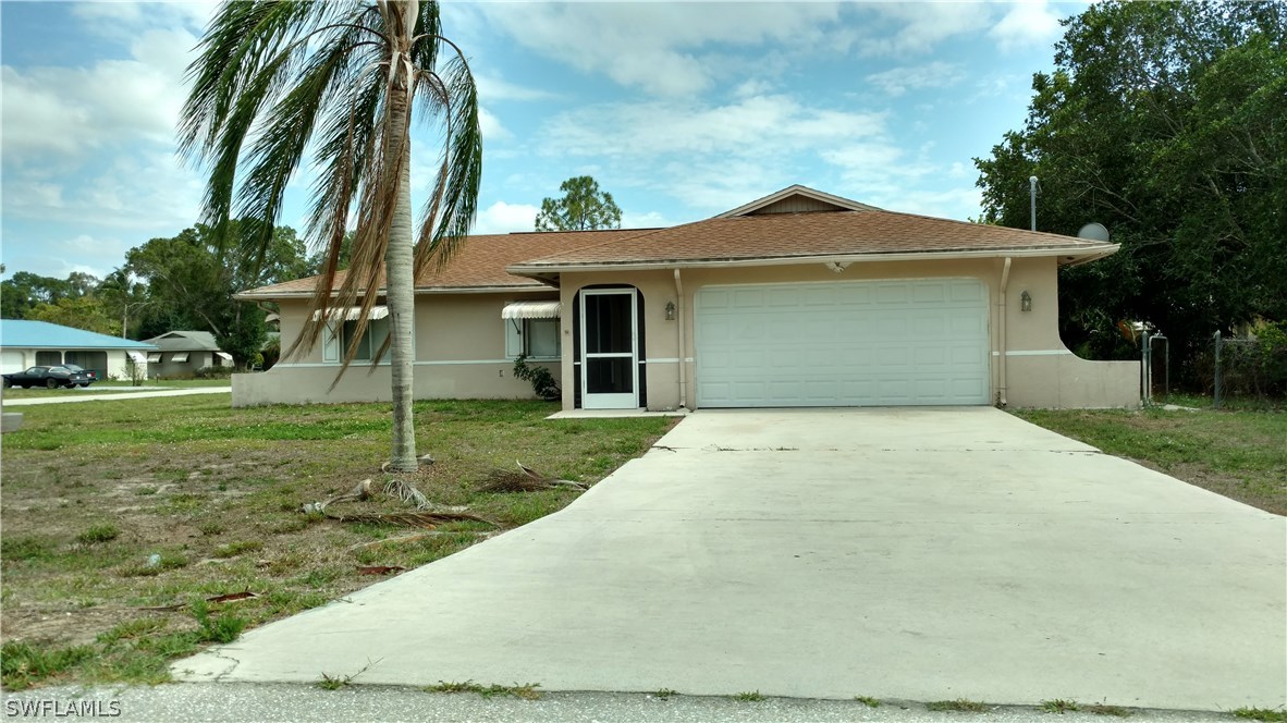 7550 Garry Road Fort Myers, FL 33967 - Photo 1 of 23 a view of a house with a yard