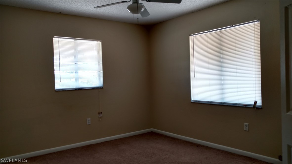 7550 Garry Road Fort Myers, FL 33967 - Photo 11 of 23 an empty room with a window