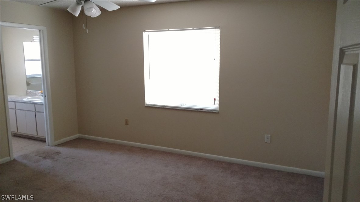 7550 Garry Road Fort Myers, FL 33967 - Photo 12 of 23 an empty room with a window