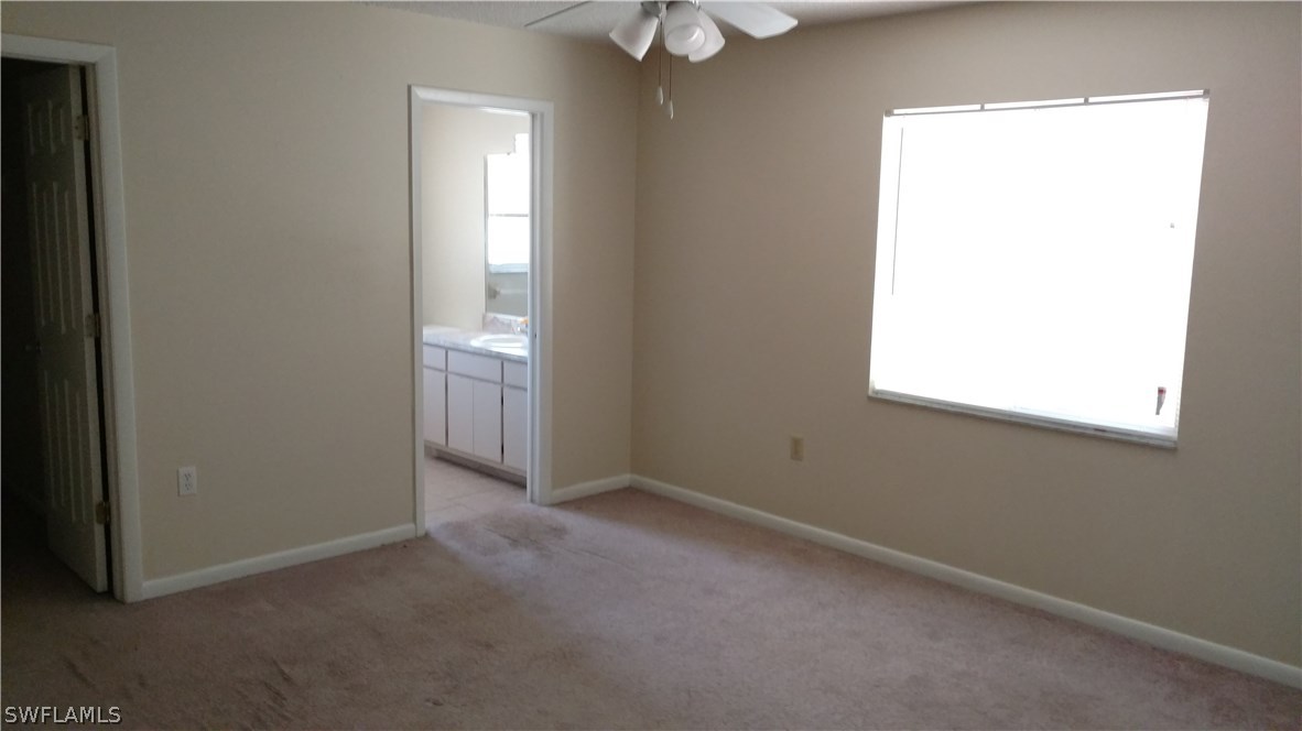 7550 Garry Road Fort Myers, FL 33967 - Photo 13 of 23 an empty room with a window