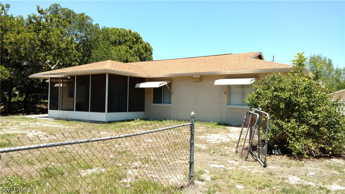 7550 Garry Road Fort Myers, FL 33967 - Photo 23 of 23 a house with trees in the background