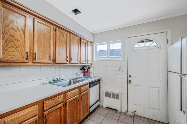 a kitchen with stainless steel appliances granite countertop a refrigerator sink and cabinets