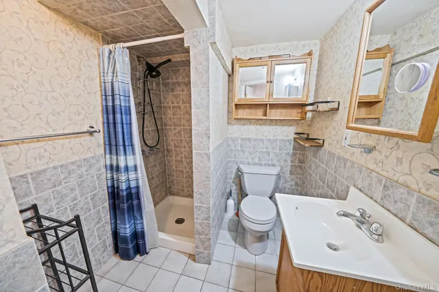 a bathroom with a sink and toilet