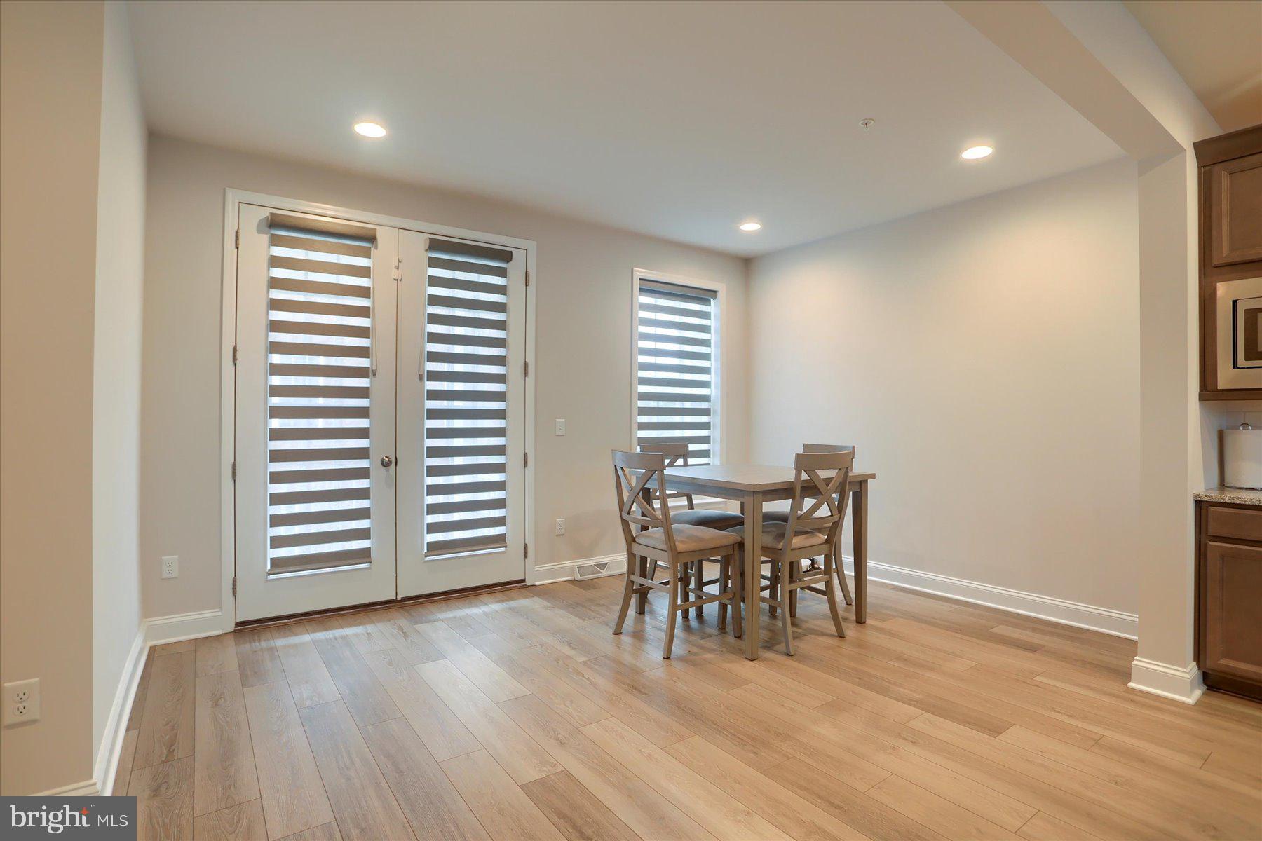 3219 Wayland Road Mechanicsburg, PA 17055 - Photo 16 of 38 a view of a dining room with furniture and wooden floor