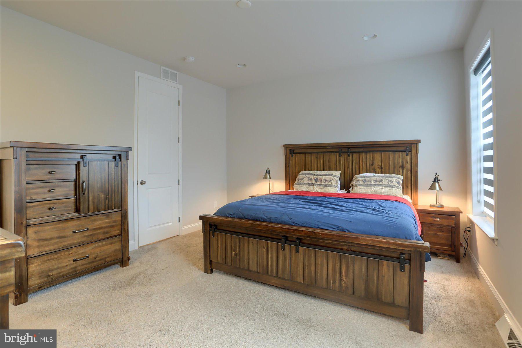 3219 Wayland Road Mechanicsburg, PA 17055 - Photo 28 of 38 a bedroom with a bed and a closet