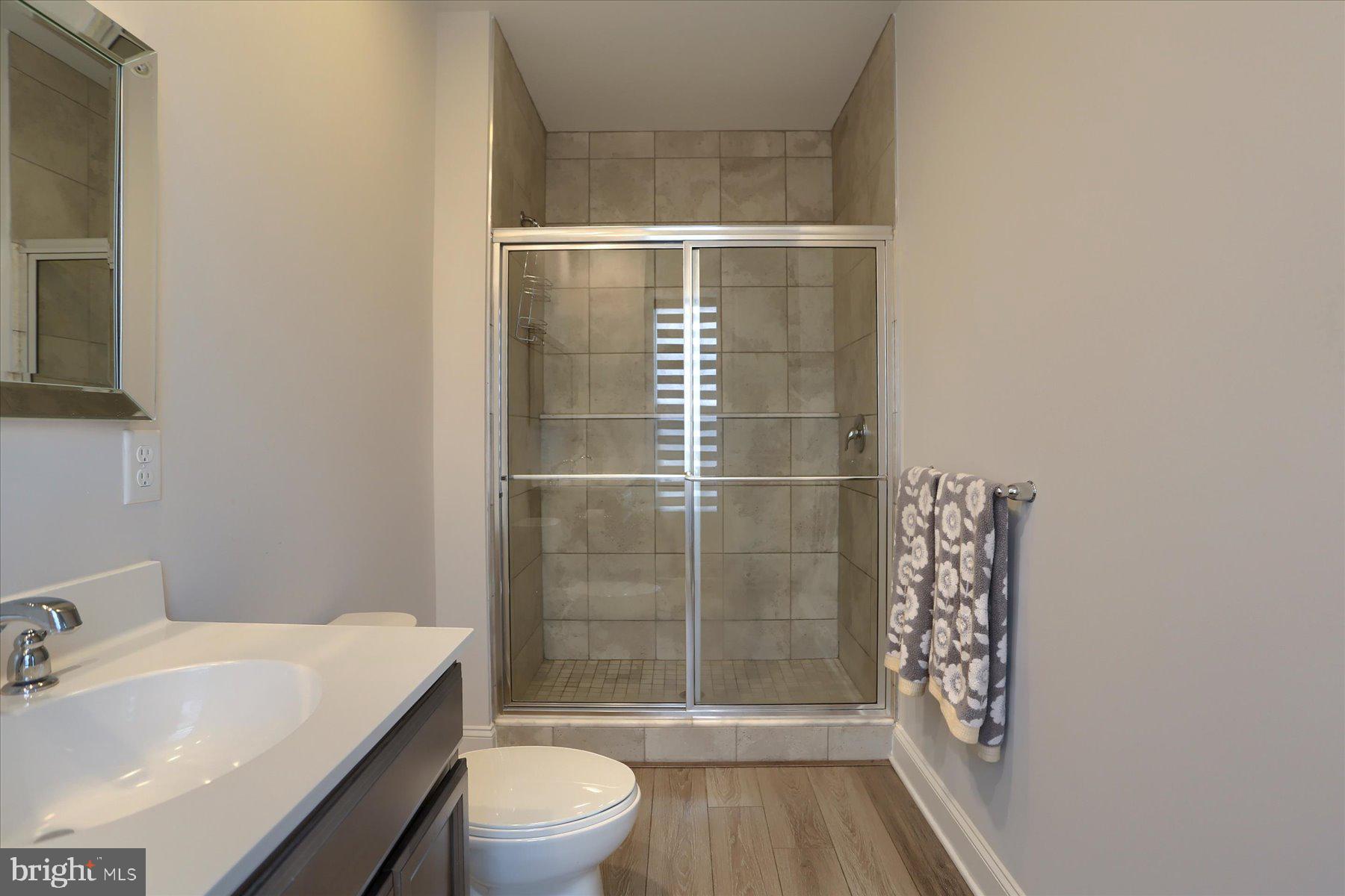 3219 Wayland Road Mechanicsburg, PA 17055 - Photo 30 of 38 a bathroom with a sink toilet and shower