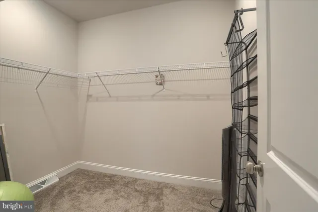 a view of a room with racks on the wall