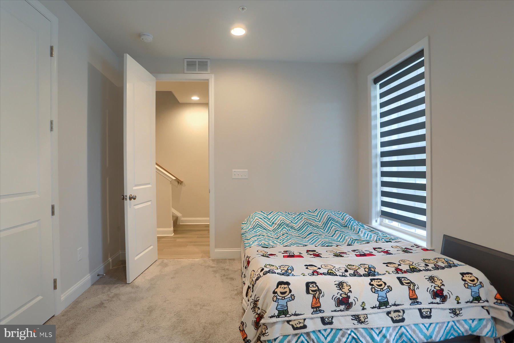 3219 Wayland Road Mechanicsburg, PA 17055 - Photo 7 of 38 a bedroom with a bed and a painting on the wall