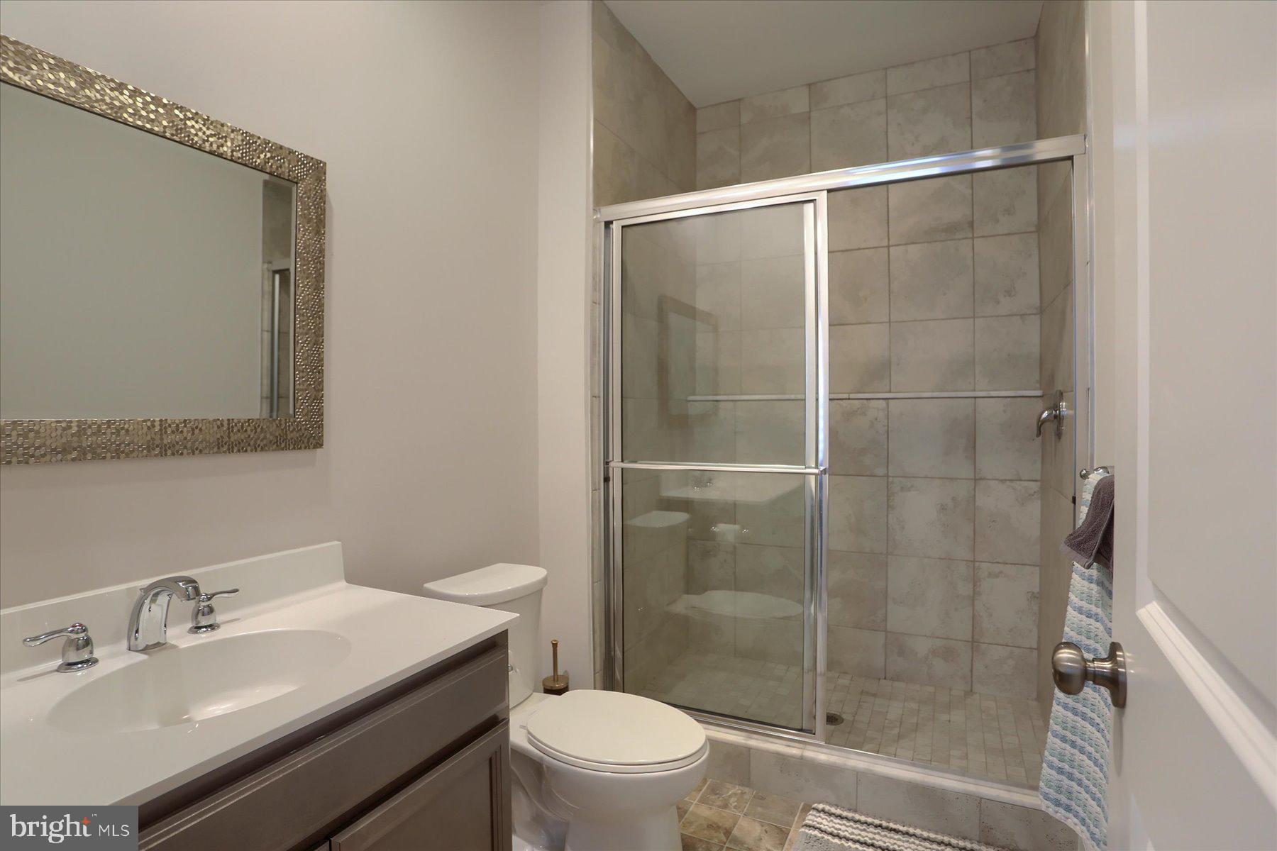 3219 Wayland Road Mechanicsburg, PA 17055 - Photo 8 of 38 a bathroom with a sink toilet and shower
