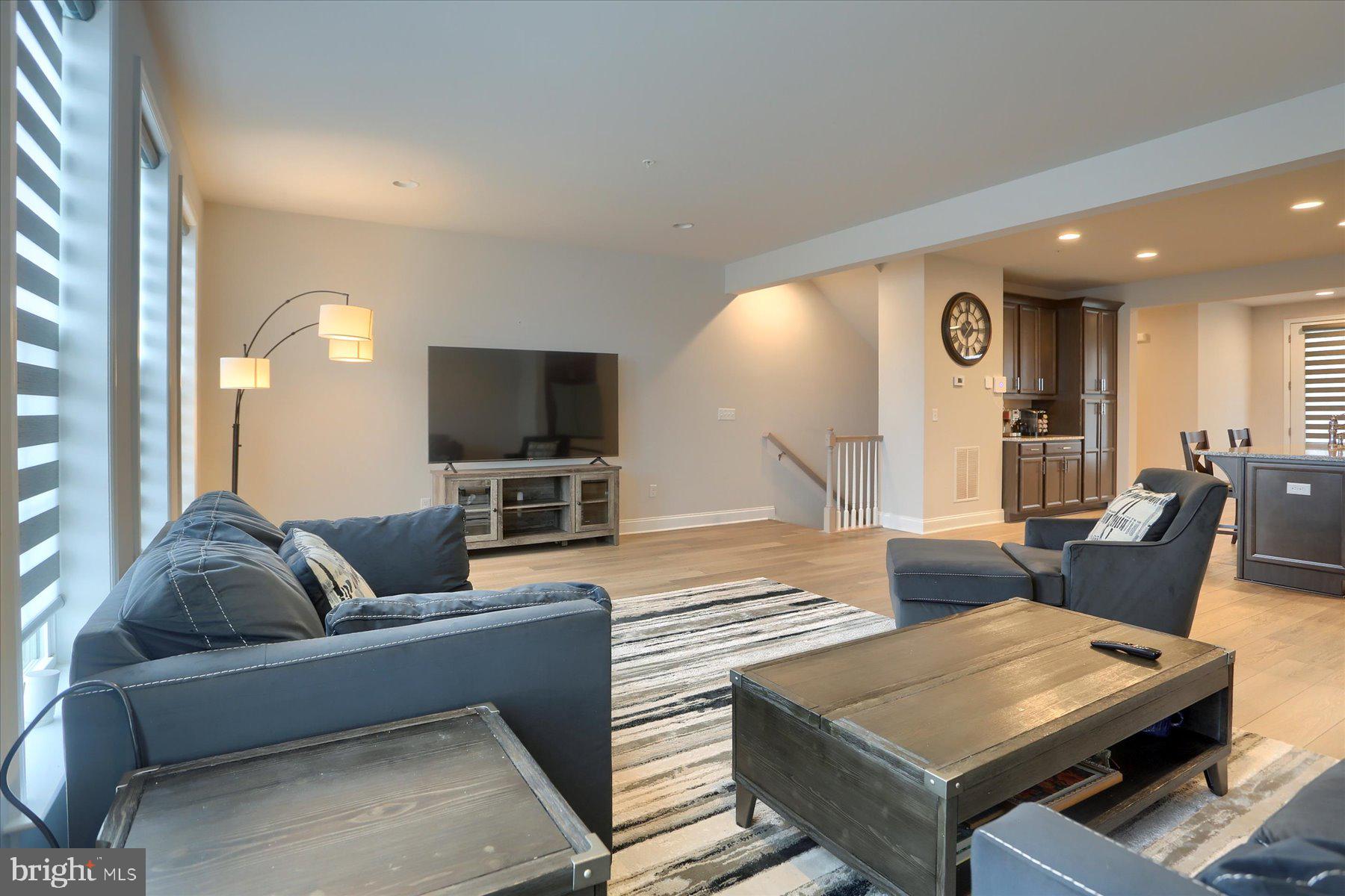 3219 Wayland Road Mechanicsburg, PA 17055 - Photo 10 of 38 a living room with furniture and a flat screen tv