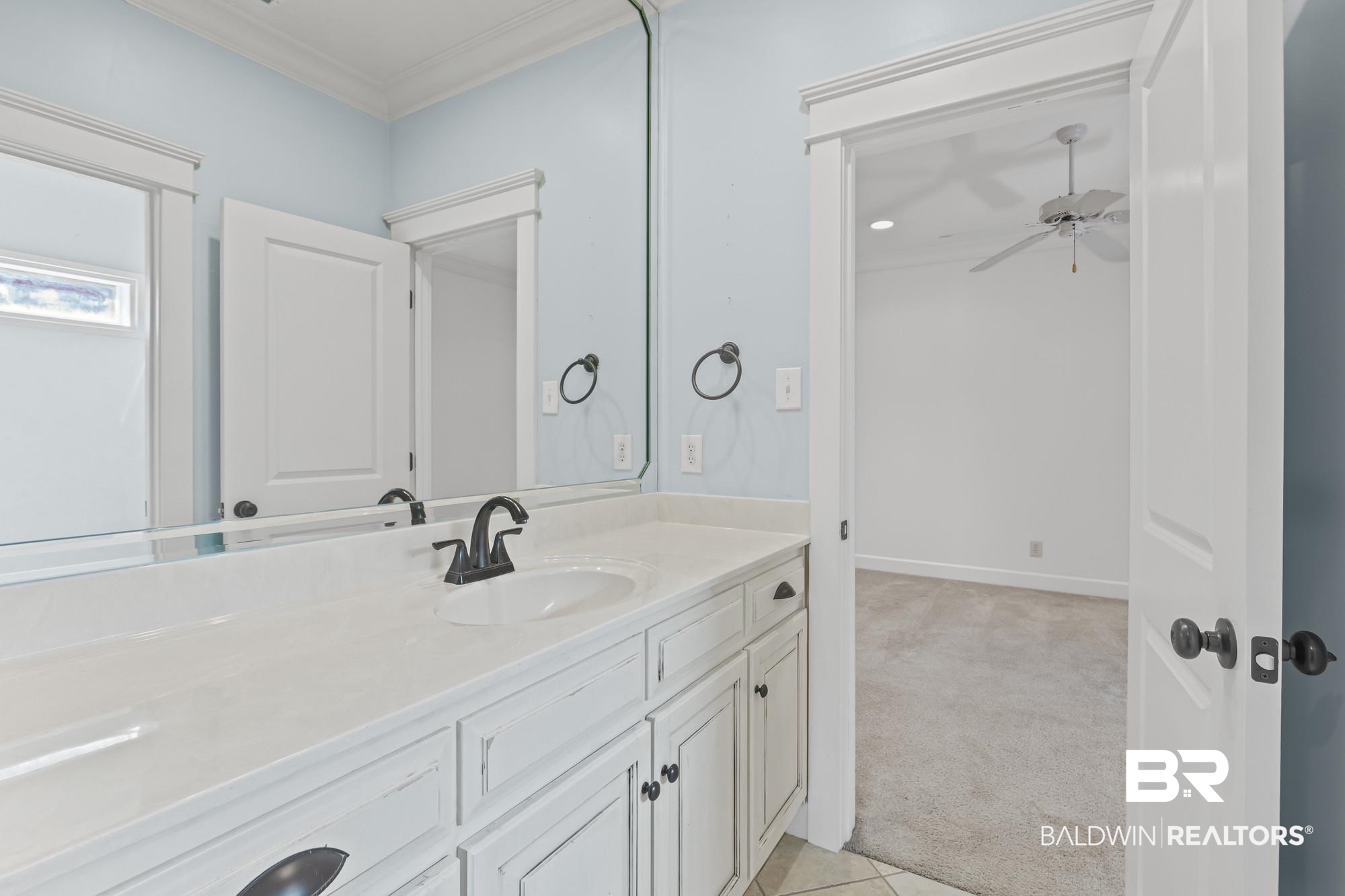 11261 Halcyon Loop Daphne, AL 36526 - Photo 23 of 41 Double vanity with white cabinetry, integrated sinks, white countertops, and matte black fixtures