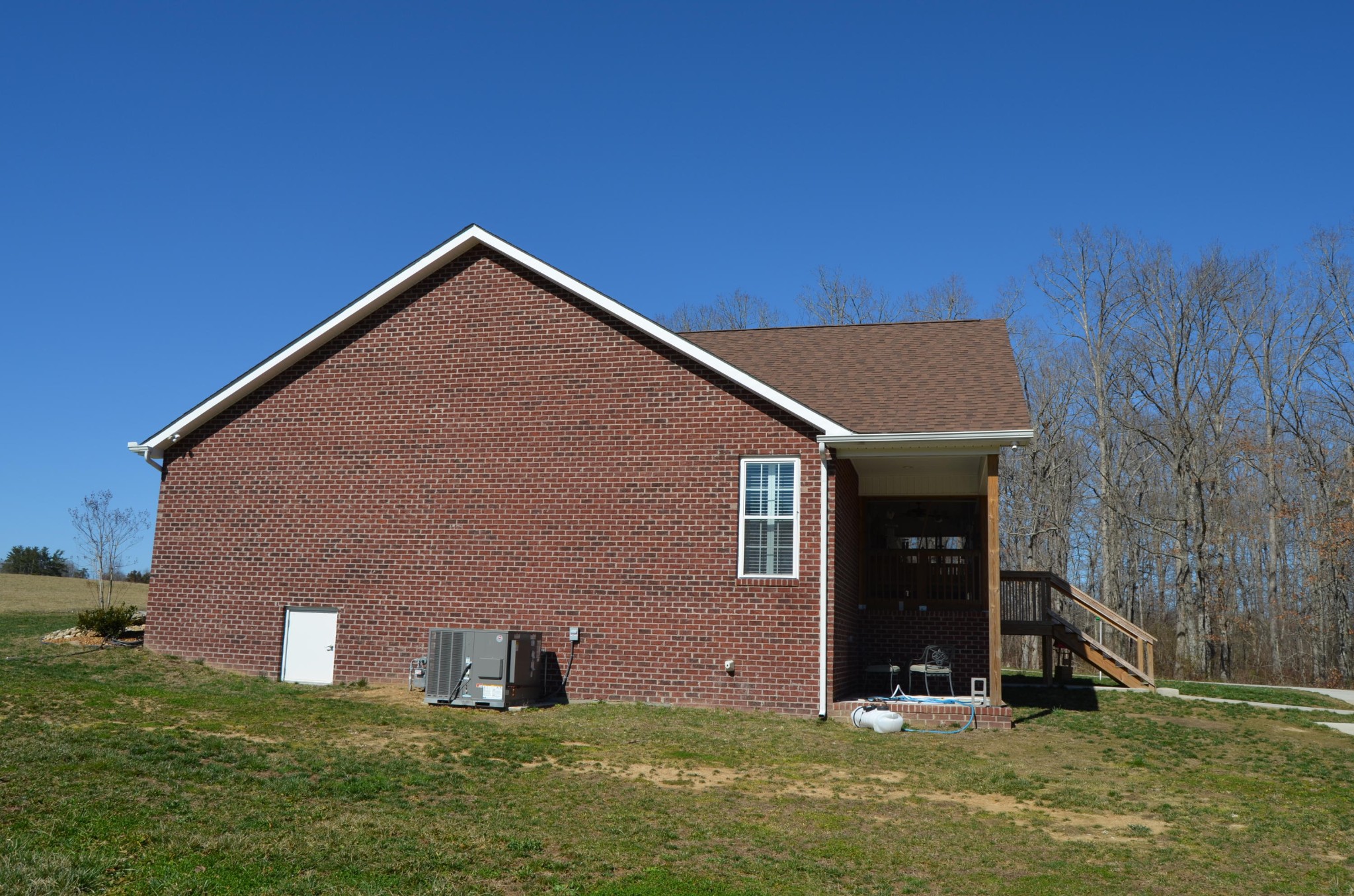 1039 Plateau Road Crossville, TN 38571 - Photo 3 of 40 a backyard of a house with lots of green space