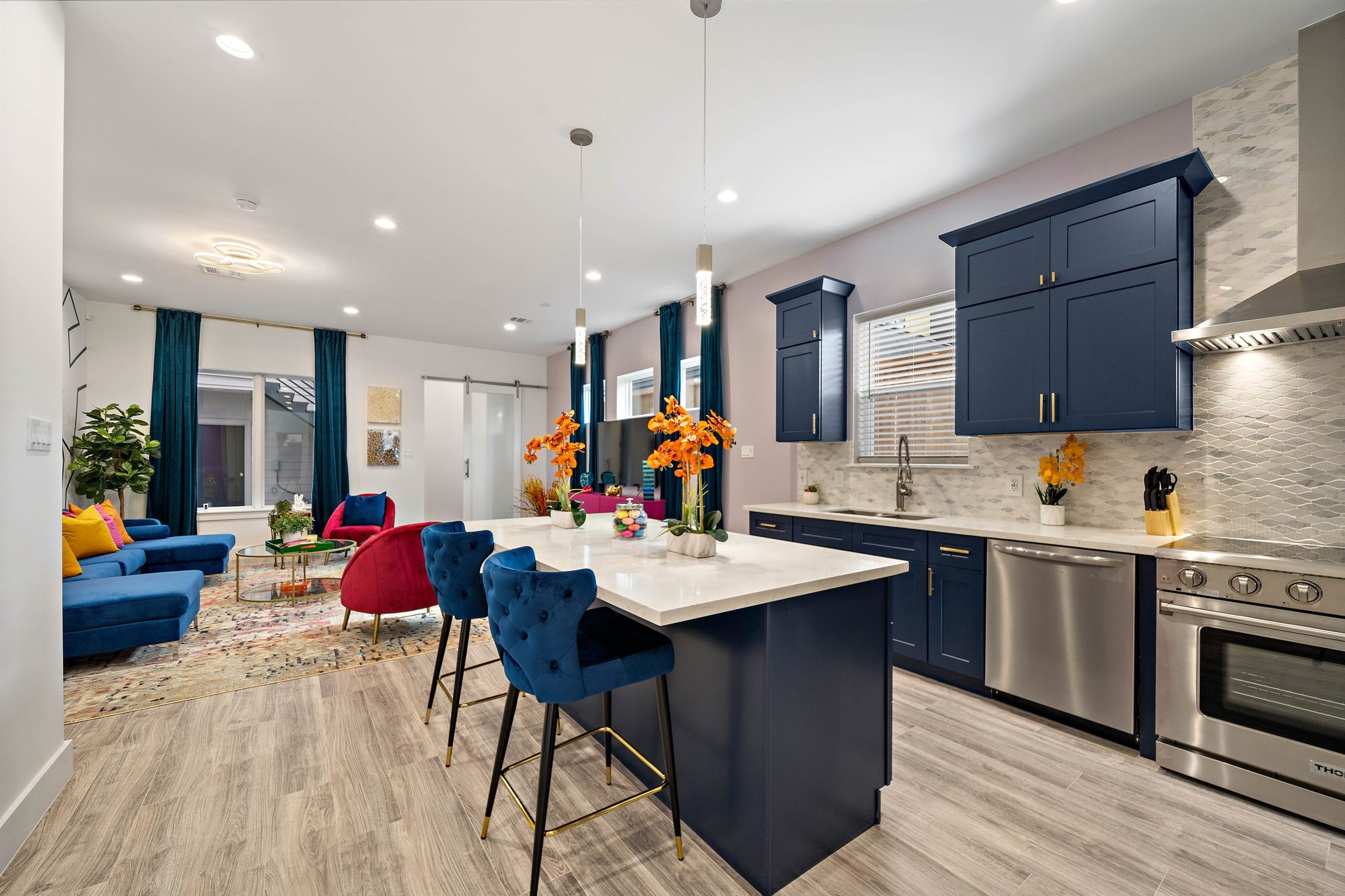 a large kitchen with a table and chairs