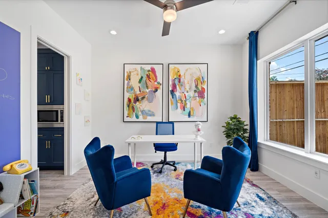 a bathroom with double vanity sinks a toilet a large mirror and a bathtub