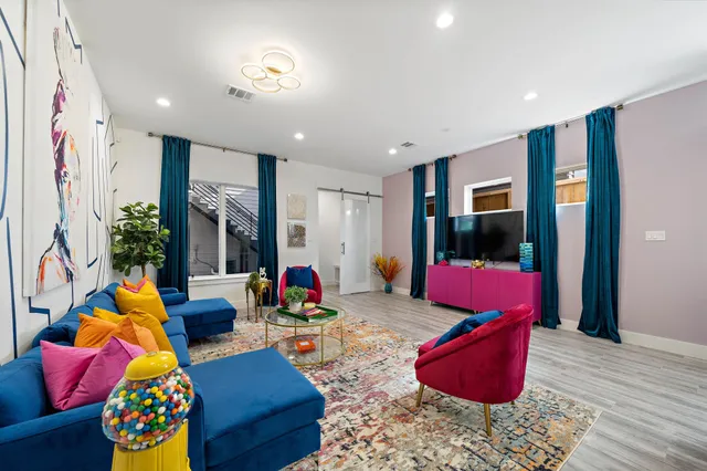 a living room with furniture and a rug