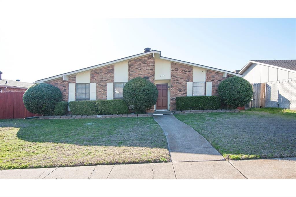 3117 Fieldview Drive Garland, TX 75044 - Photo 1 of 26 Mid-century inspired home featuring a front lawn, fence, and brick siding