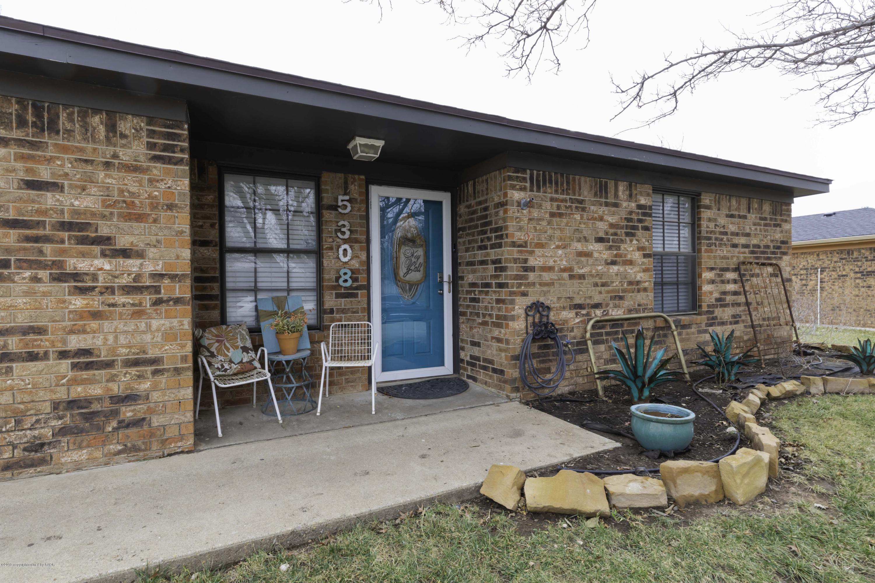 5308 Wheeler Lane Amarillo, TX 79110 - Photo 3 of 41 a backyard of a house with seating space