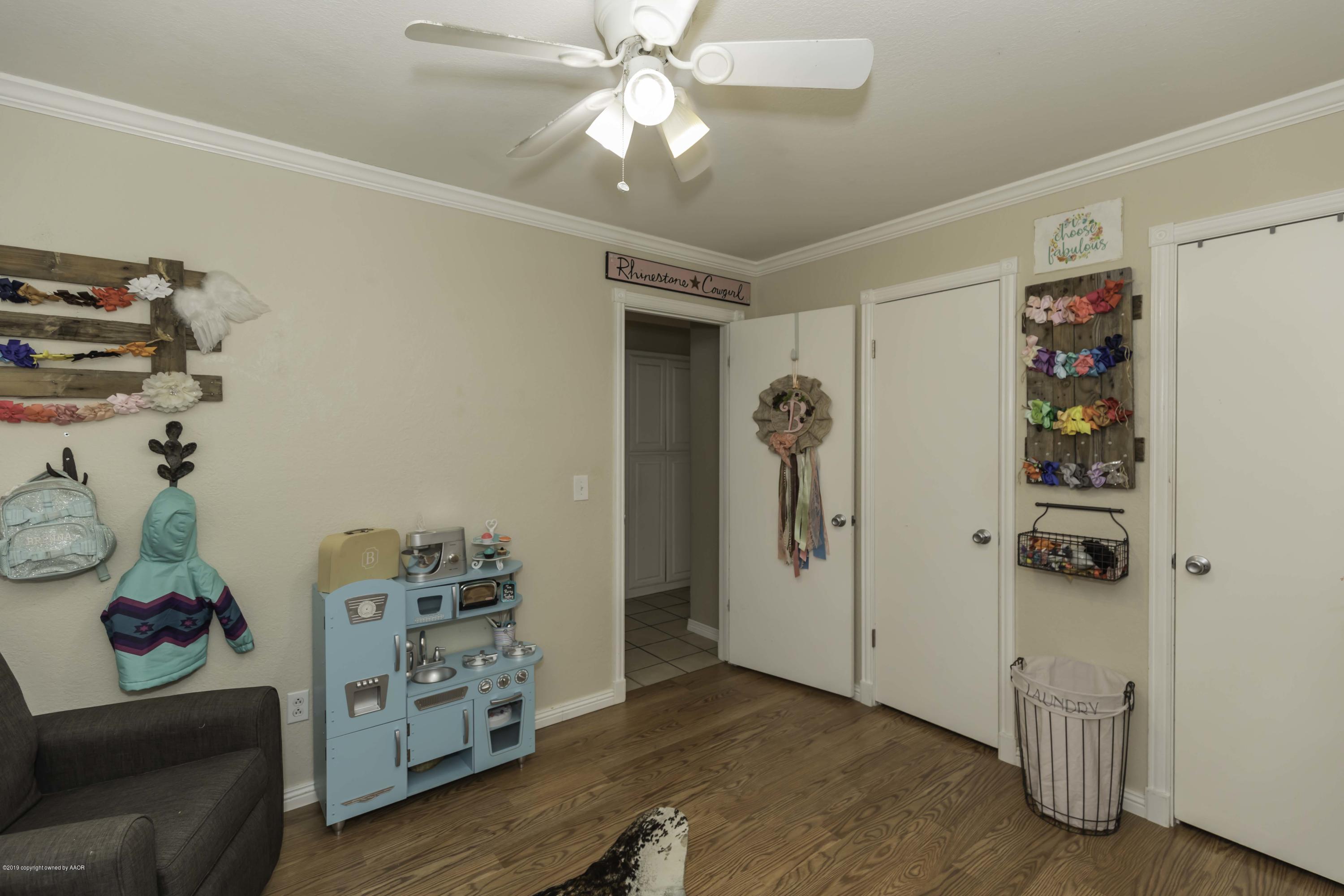 5308 Wheeler Lane Amarillo, TX 79110 - Photo 23 of 41 a living room with furniture and a window