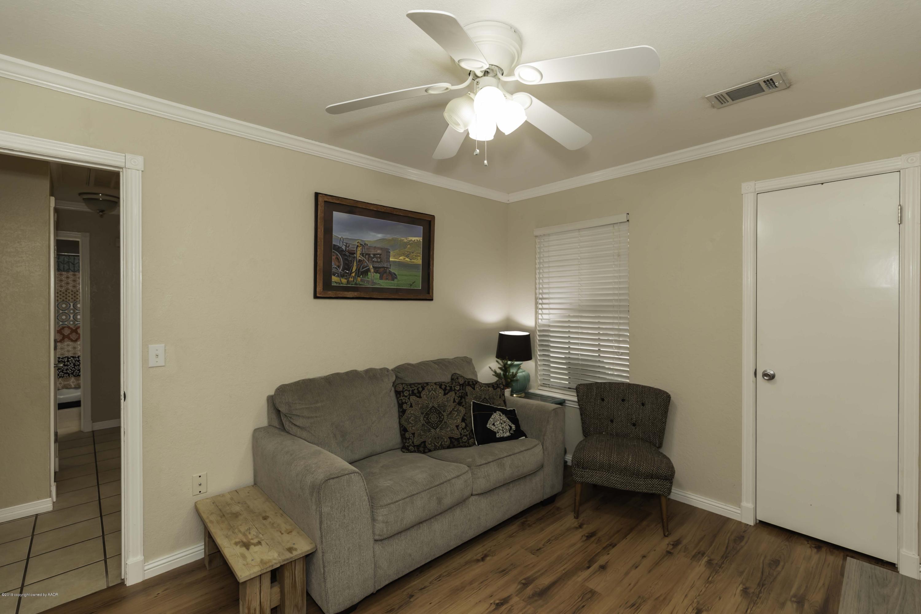 5308 Wheeler Lane Amarillo, TX 79110 - Photo 29 of 41 a living room with furniture and a window
