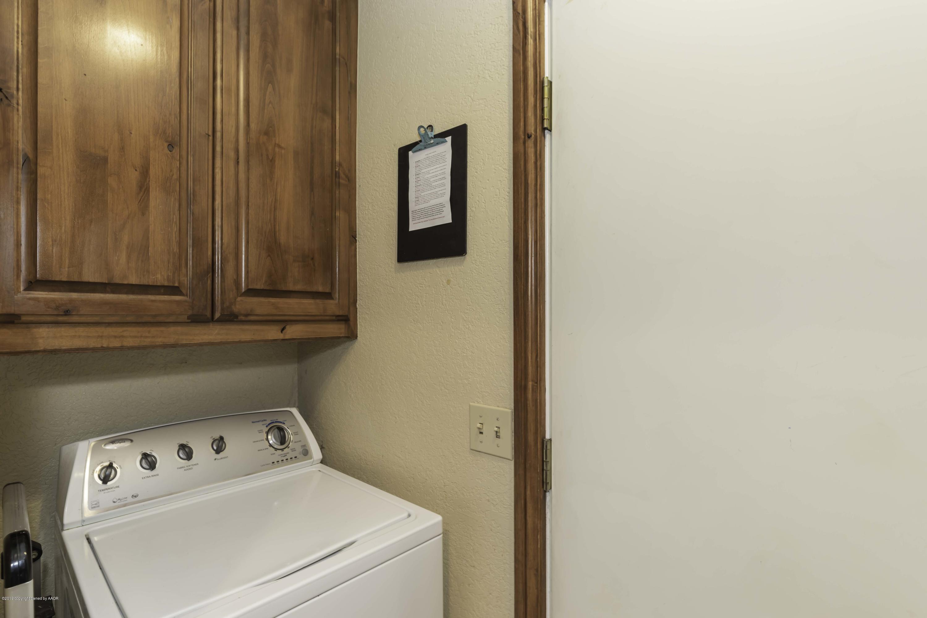5308 Wheeler Lane Amarillo, TX 79110 - Photo 34 of 41 a utility room with dryer and washer