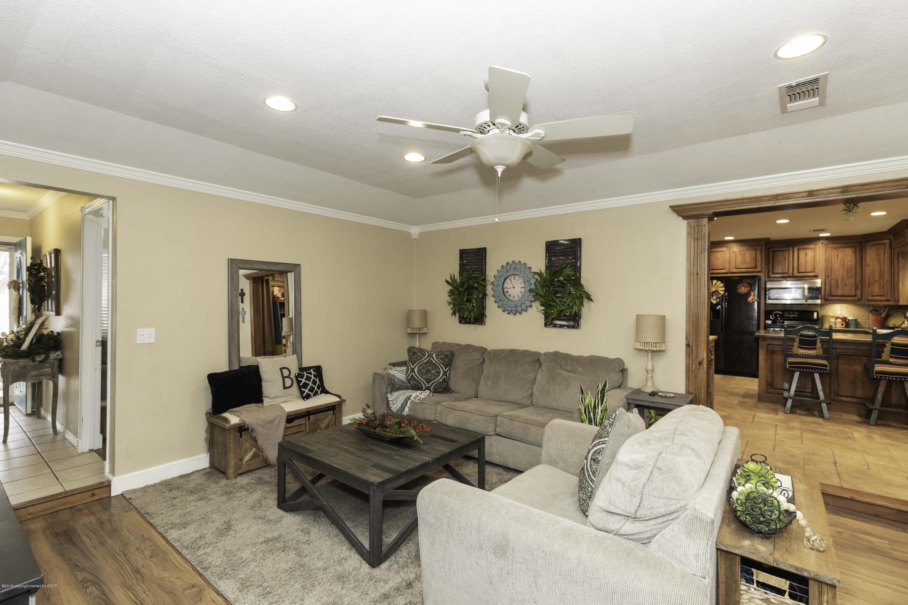 5308 Wheeler Lane Amarillo, TX 79110 - Photo 8 of 41 a living room with furniture and wooden floor