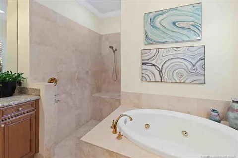 a view of a swimming pool with a yard and plants