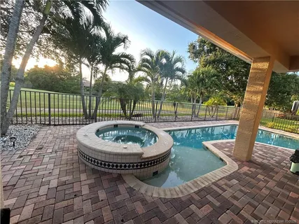 a view of a golf course with an ocean