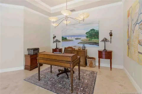 a living room filled with furniture and a rug