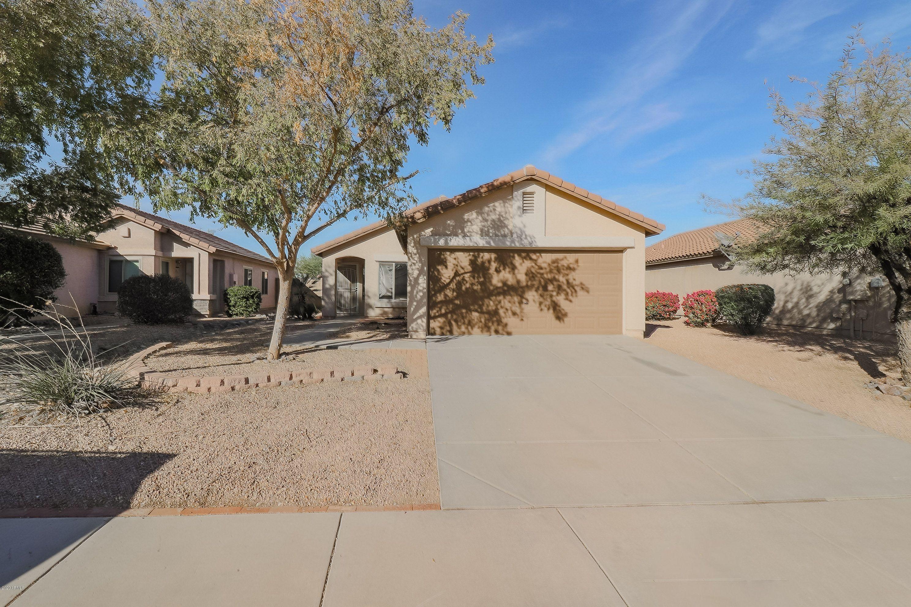 15038 West Redfield Road Surprise, AZ 85379 - Photo 1 of 21 a front view of a house with a yard covered with snow