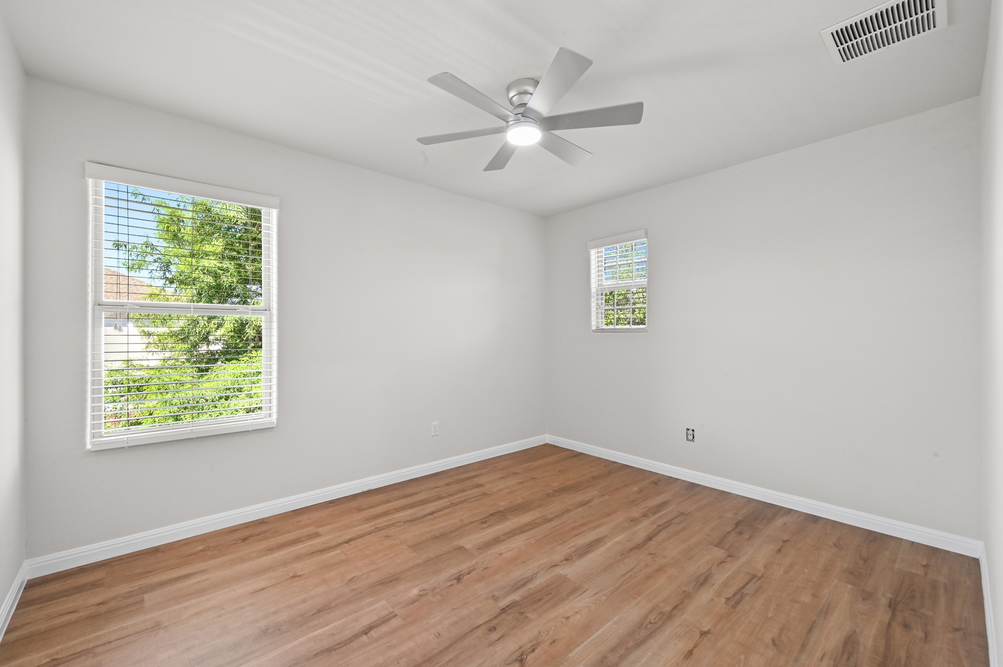 351 Wincliff Drive Buda, TX 78610 - Photo 29 of 40 Hardwood-style flooring and a ceiling fan create a comfortable ambiance in this naturally illuminated space.