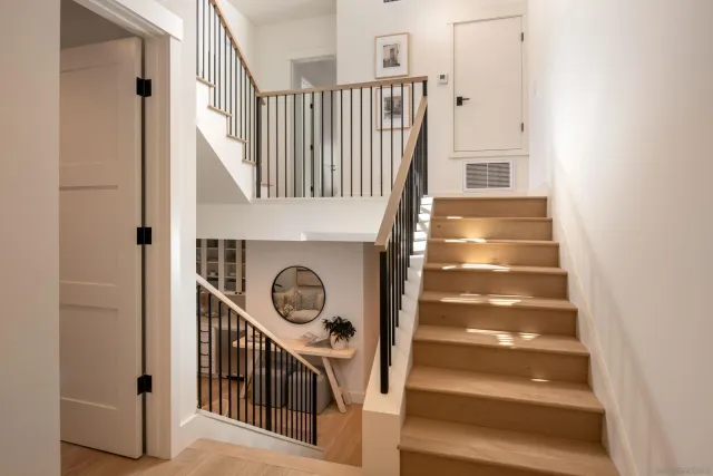 a view of entryway with wooden floor and a front door