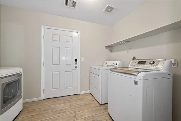 a utility room with dryer and washer