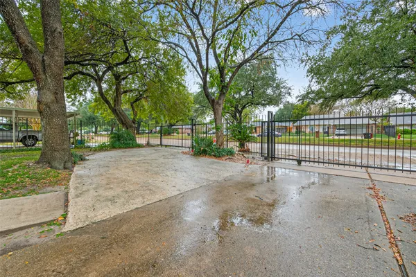 a view of park with large trees