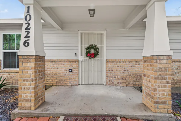 a view of a brick house with an empty space