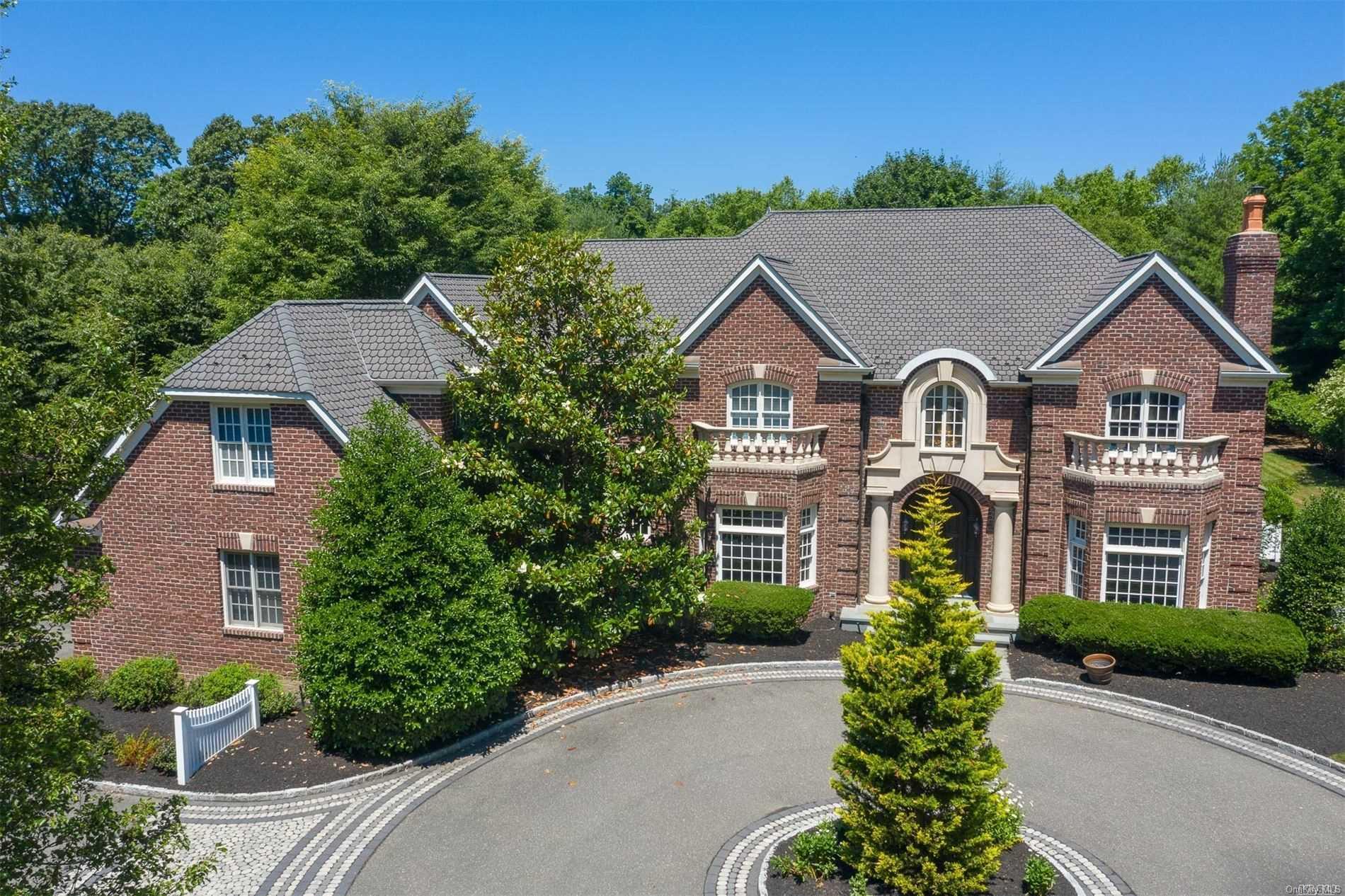 534 Long Beach Road St. James, NY 11780 - Photo 1 of 1 a front view of a house with a garden