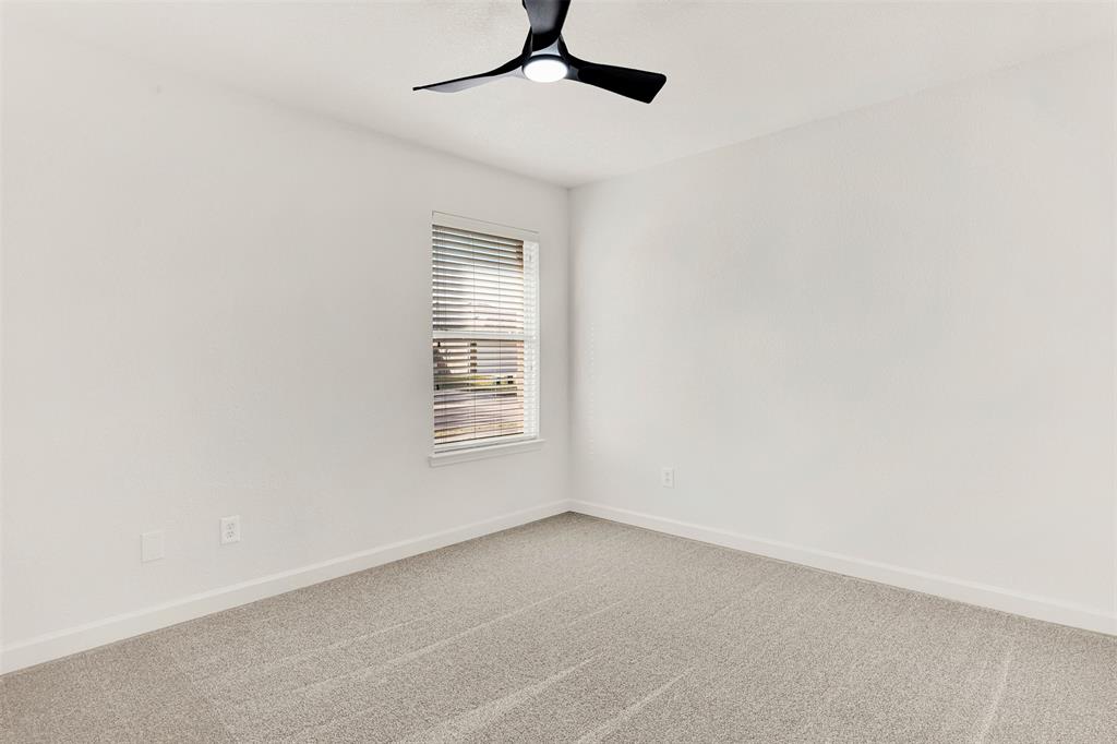 3601 Cottonwood Road Melissa, TX 75454 - Photo 22 of 36 an empty room with a window and a ceiling fan