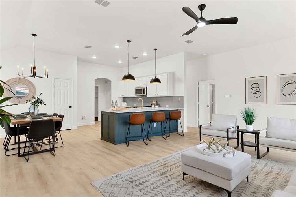 3601 Cottonwood Road Melissa, TX 75454 - Photo 10 of 36 a living room with furniture a rug and white walls