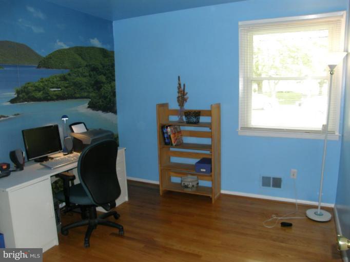 6221 Commons Road Rosedale, MD 21237 - Photo 12 of 27 a view of a workspace with furniture and a window