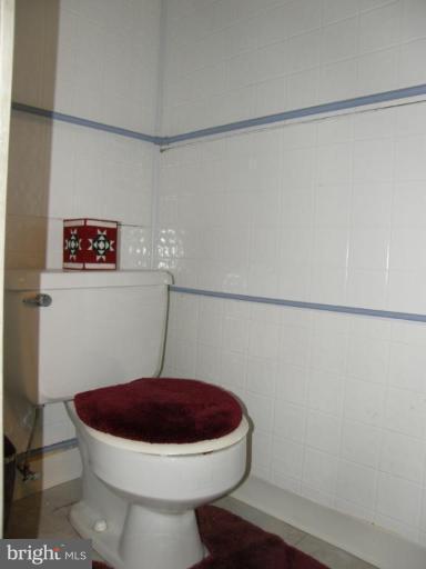 6221 Commons Road Rosedale, MD 21237 - Photo 15 of 27 a bathroom with a toilet and a shower