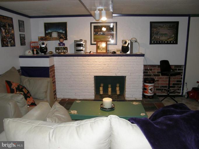 6221 Commons Road Rosedale, MD 21237 - Photo 18 of 27 a living room with furniture and a fireplace