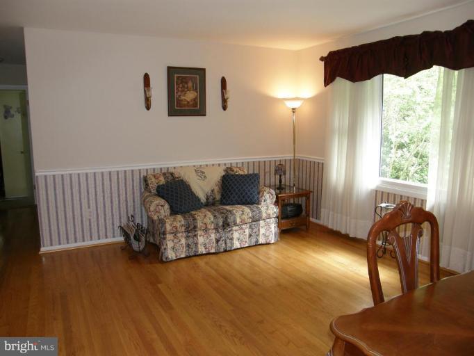 6221 Commons Road Rosedale, MD 21237 - Photo 3 of 27 a living room with furniture and a large window