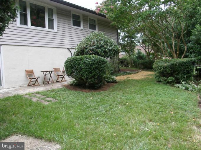 6221 Commons Road Rosedale, MD 21237 - Photo 22 of 27 a view of backyard with table and chairs and potted plants