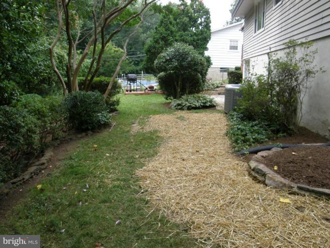 6221 Commons Road Rosedale, MD 21237 - Photo 23 of 27 a view of backyard of house with green space